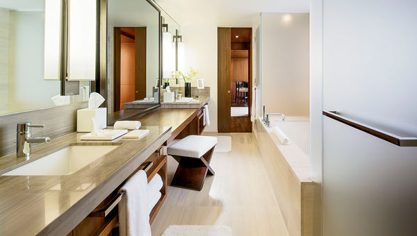 The hotel’s marble-clad bathrooms feature rainfall showerheads. The hotel’s marble-clad bathrooms feature rainfall showerheads.