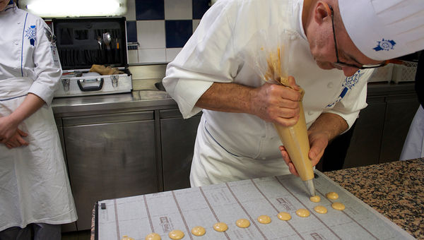 Chef Jean-Jacques Tranchant of Le Cordon Bleu shows Avalon Waterways guests how to make macarons. Chef Jean-Jacques Tranchant of Le Cordon Bleu shows Avalon Waterways guests how to make macarons.