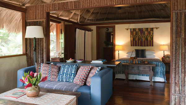 Blancaneaux Lodge's thatched roofs help keep the rooms ventilated. An organic garden at supplies 80% of its produce.