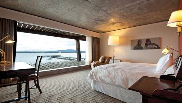A king guestroom at the Singular Patagonia. The property was built in the converted Frigorifico Puerto Bories facility.