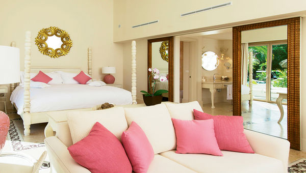 An 825-square-foot junior suite features a bathroom with a deep Jacuzzi tub, indoor and outdoor showers and French and Italian Riviera decor as well as a coral stone floor and brightly painted exterior that are a nod to the hotel’s Caribbean setting. An 825-square-foot junior suite features a bathroom with a deep Jacuzzi tub, indoor and outdoor showers and French and Italian Riviera decor as well as a coral stone floor and brightly painted exterior that are a nod to the hotel’s Caribbean setting.