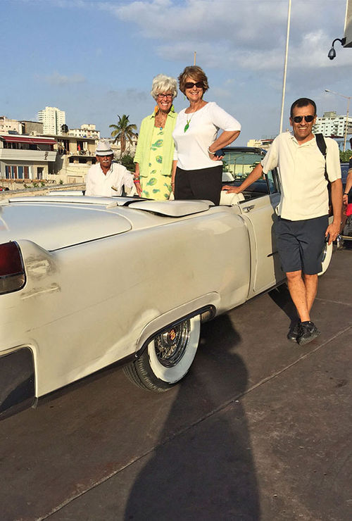 Gay Nagle Myers with travel agents Rosemarie Leone and Tim Welch and a ’59 Chevy.