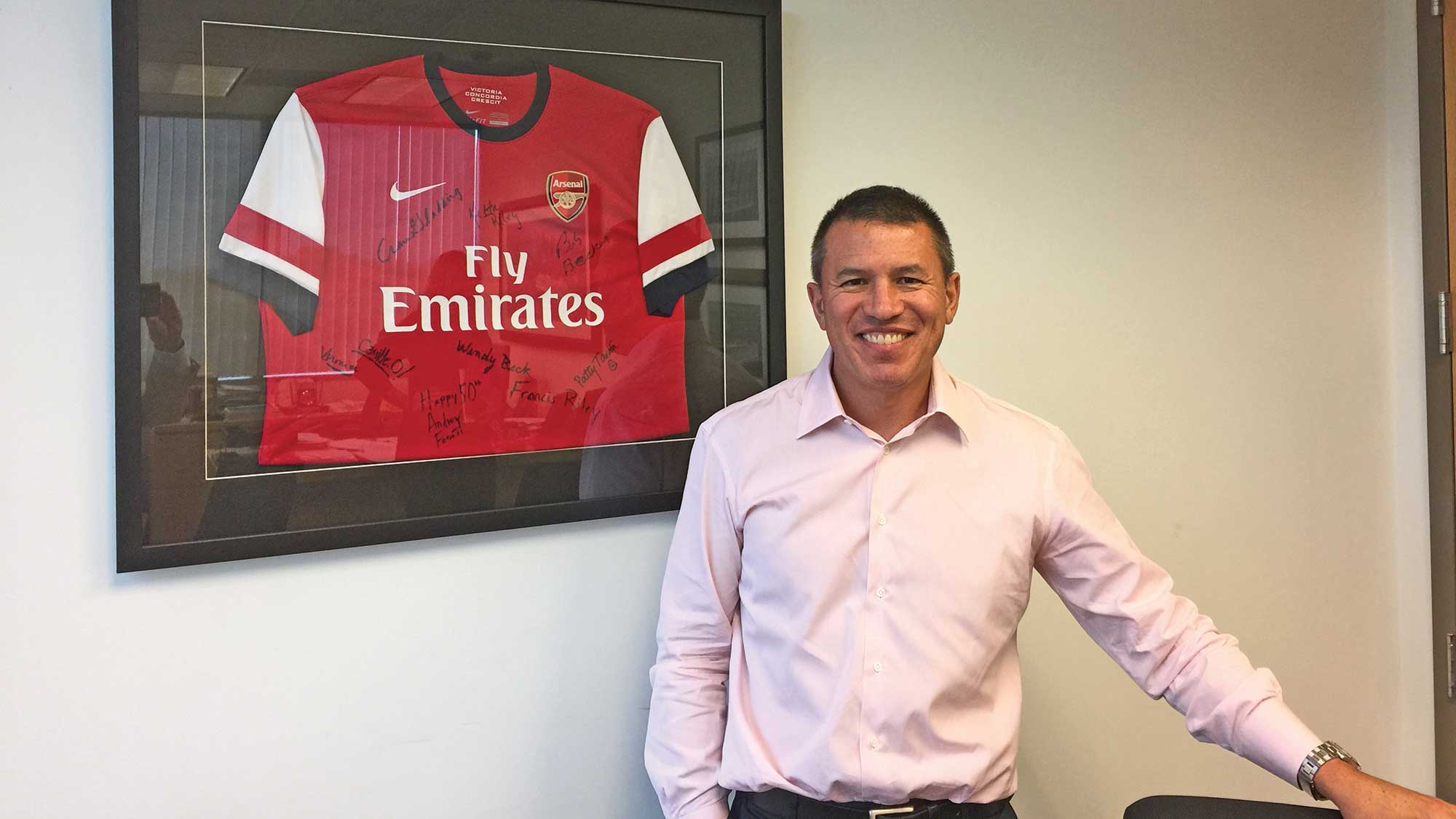 Norwegian Cruise Line president and CEO Andy Stuart in his office in 2015 with a framed jersey from London's Arsenal Football Club, his favorite soccer team.