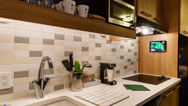 An Element hotel kitchen, with touchscreen cookbook on the wall. An Element hotel kitchen, with touchscreen cookbook on the wall.