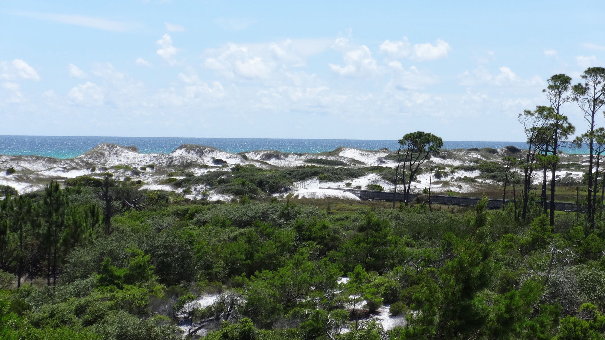 Dunes frame the Gulf of Mexico at Topsail Hill Preserve State Park in Florida.
