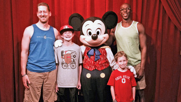 The author, left, with his partner, Lance Jethrow, and children Matthew, 8, and Joshua, 14, meet Mickey Mouse. The author, left, with his partner, Lance Jethrow, and children Matthew, 8, and Joshua, 14, meet Mickey Mouse.
