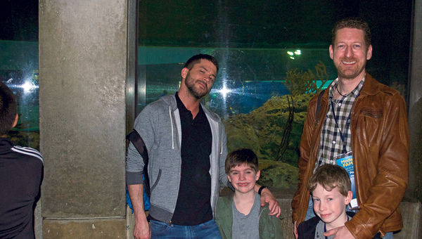 Blogger and journalist Frank Lowe with his son, Briggs, join the author and his son at the National Aquarium.