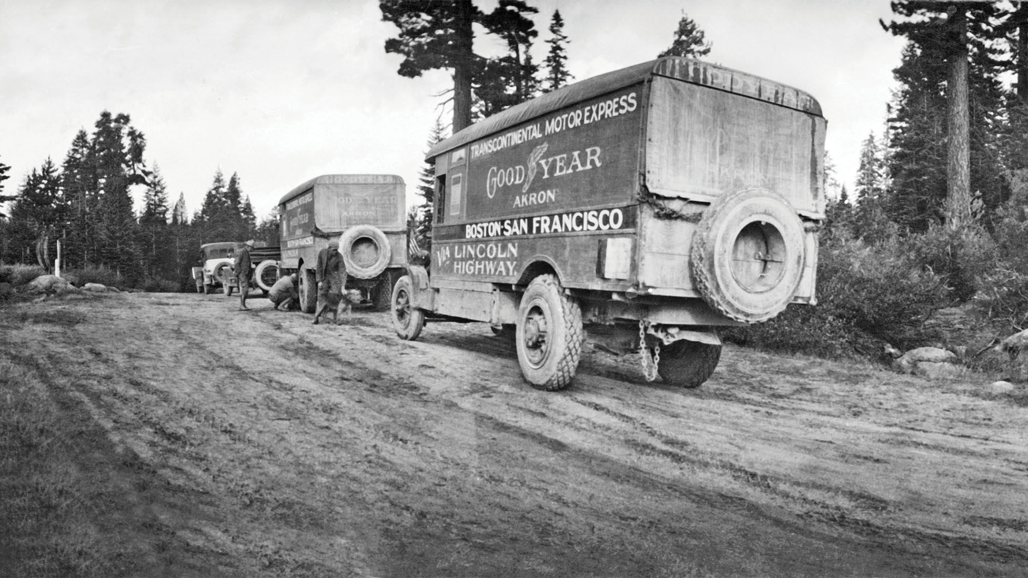 The caravan of trucks and cars of the Goodyear Wingfoot Express traveling on the Lincoln Highway.