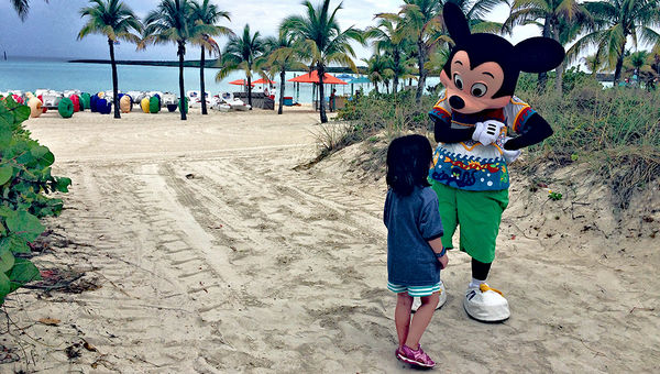 The author's daughter meets Mickey Mouse on Disney Cruise Line's private island, Castaway Cay. The author's daughter meets Mickey Mouse on Disney Cruise Line's private island, Castaway Cay.