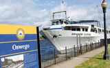Blount Small Ship Adventures vessel the Grande Caribe at Oswego on an Erie Canal itinerary. The line says it is the only overnight cruise ship on the canal.