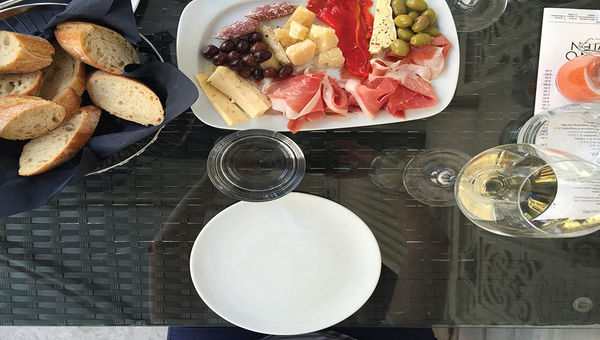 The first stop on a culinary tour of Vienna included a glass of Viennese white wine and local charcuterie.