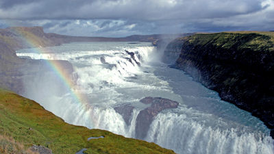 Gullfoss (Golden Waterfalls) is a highlight of the popular Golden Circle day tour that originates in Reykjavik, and on a sunny day, rainbows commonly augment the stepped falls' natural beauty.