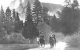 President Theodore Roosevelt and conservationist John Muir riding horses in Yosemite National Park.