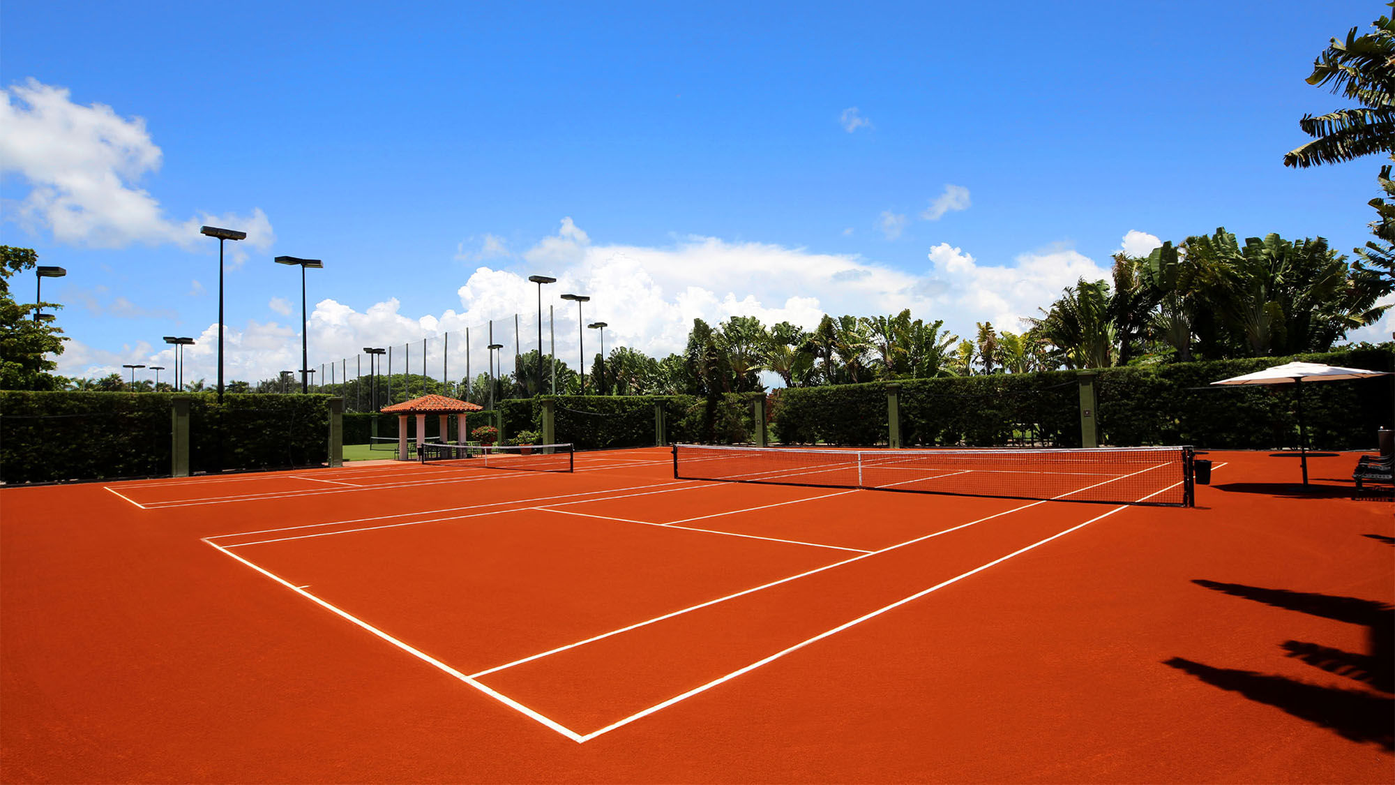 With the addition of two red clay courts, Fisher Island now sports all three playing surfaces that are used in tennis' Grand Slam events.