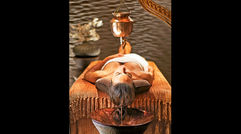 With a thriving spa industry, revamped menus and other initiatives, Las Vegas is focusing on offering healthy options amid its famed excess. Pictured here, a Shirodhara scalp treatment can be added to a massage at Caesars Palace's Qua Baths & Spa.