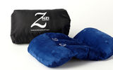Six embedded magnets enable a sleep-deprived traveler to form this plush pillow's shape to adapt to virtually anyone's comfort zone no matter the trim of a seat or mode of transportation. Let your imagination loose, then snap, roll or stick this pillow to form any configuration you find comfortable. Two suction cups enable easy window sitting. The Znzi Travel Pillow comes in a nylon travel bag that includes double straps and a clasp for sliding over luggage handles or clipping to a backpack or purse.