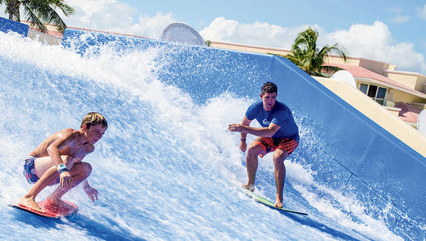 Kids enjoy the FlowRider at Moon Palace Golf & Spa Resort in Cancun. Kids enjoy the FlowRider at Moon Palace Golf & Spa Resort in Cancun.