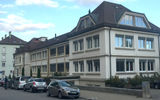 A row of window-dominant watchmakers homes. The city was also laid out in a grid to maximize light; it's unusual architecture and layout has earned La Chaux-de-Fonds a spot as a UNESCO World Heritage Site.