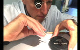 Tiny screws are handled with tweezers...