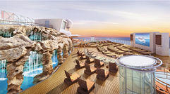 With some 40 new ships set to be delivered in the next five years, cruise lines are vying to outdo each other with design innovations to differentiate their vessels. Pictured here, a waterfall grotto has been added to the Spice H2O nightclub area on the Norwegian Escape to help with the distribution of passengers around the ship.
