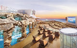With some 40 new ships set to be delivered in the next five years, cruise lines are vying to outdo each other with design innovations to differentiate their vessels. Pictured here, a waterfall grotto has been added to the Spice H2O nightclub area on the Norwegian Escape to help with the distribution of passengers around the ship.