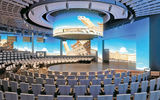 A rendering of the World Stage, a circular theater with two-story LED screens surrounding the audience on Holland America Line's Koningsdam.