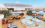 A rendering of the Koningsdam's main pool area, which features a two-story covered pool area, a first for a Holland America ship.