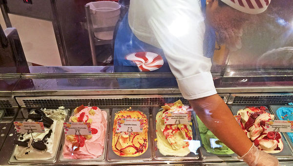 A castmember scoops out handmade gelato at Vanellope’s Sweets and Treats, a new sweet shop on the Disney Dream. A castmember scoops out handmade gelato at Vanellope’s Sweets and Treats, a new sweet shop on the Disney Dream.