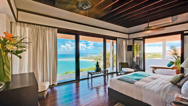 The villa’s master bedroom offers striking ocean views. The villa’s master bedroom offers striking ocean views.