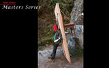 A Sherpa carrying building supplies and a chair rests on the Himalayan trail.