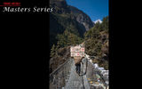A Sherpa crosses a suspension bridge in the Himalayas on the way to Namche Bazaar.