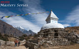 Children pass a Buddhist Stupa on the trail between Namche Bazaar and Khumjung in the Himalayas.