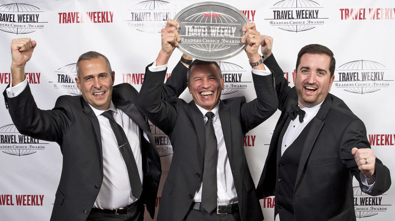 During a black-tie gala dinner and ceremony at the Conrad New York on Dec. 15, Travel Weekly honored the best of the best in airlines, car rentals, hospitality, rail tours, GDSs, agent education, tour operators, cruising, destinations and theme parks. Pictured here, Alex Pinelo, Andy Stuart and Nathan Hickman of Norwegian Cruise Line.