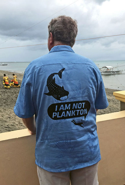 Richard Fain’s shirt reflects a common concern in Donsol, the Philippine’s whale shark-watching capital. Richard Fain’s shirt reflects a common concern in Donsol, the Philippine’s whale shark-watching capital.
