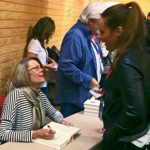 Elizabeth Becker signs a copy of “Overbooked” in Puerto Varas, Chile. Elizabeth Becker signs a copy of “Overbooked” in Puerto Varas, Chile.