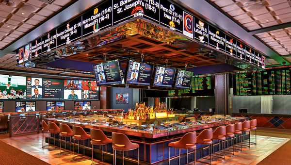 The new sports book at the Cosmopolitan has living-room-style seating, a gaming pit and free billiards and shuffleboard. The new sports book at the Cosmopolitan has living-room-style seating, a gaming pit and free billiards and shuffleboard.