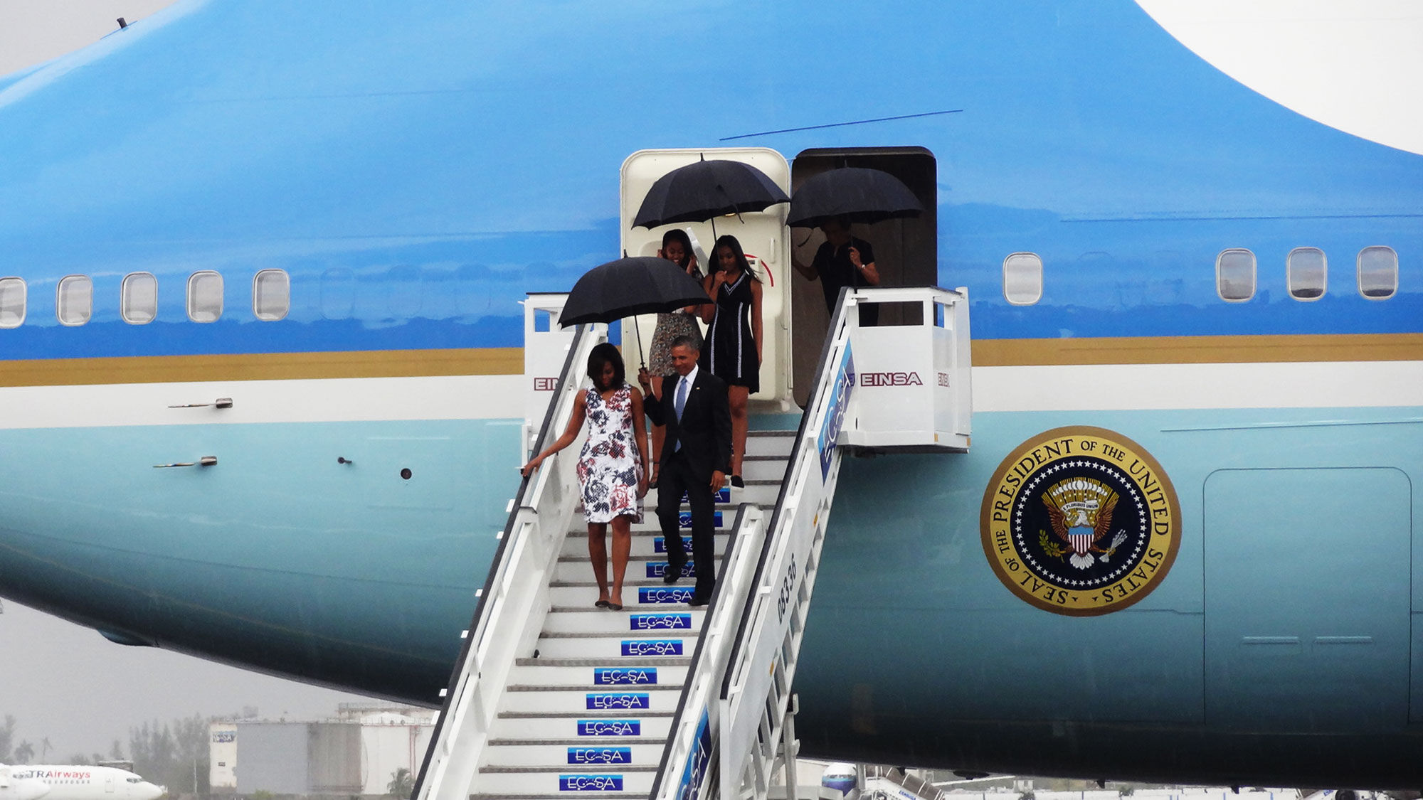 President Obama and family disembarking Air Force One in Cuba on Sunday.