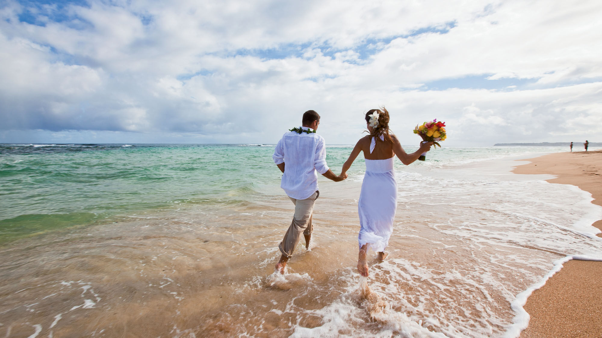 Romantic beaches, like this one on Kauai, sell Hawaii as a honeymoon and wedding destination.