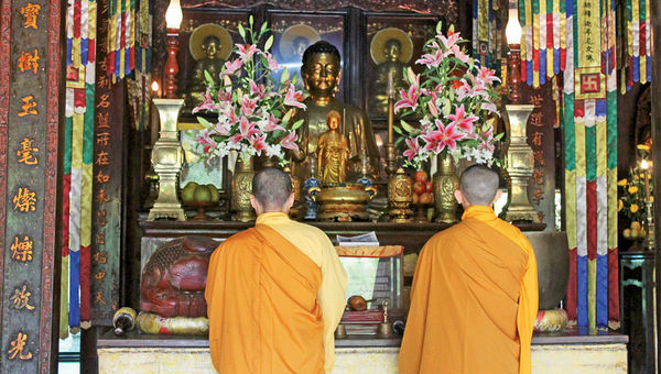 Monks pray at the Tu Hieu Pagoda, one of the possible stops on a tour organized by the Hue Rider company. Monks pray at the Tu Hieu Pagoda, one of the possible stops on a tour organized by the Hue Rider company.