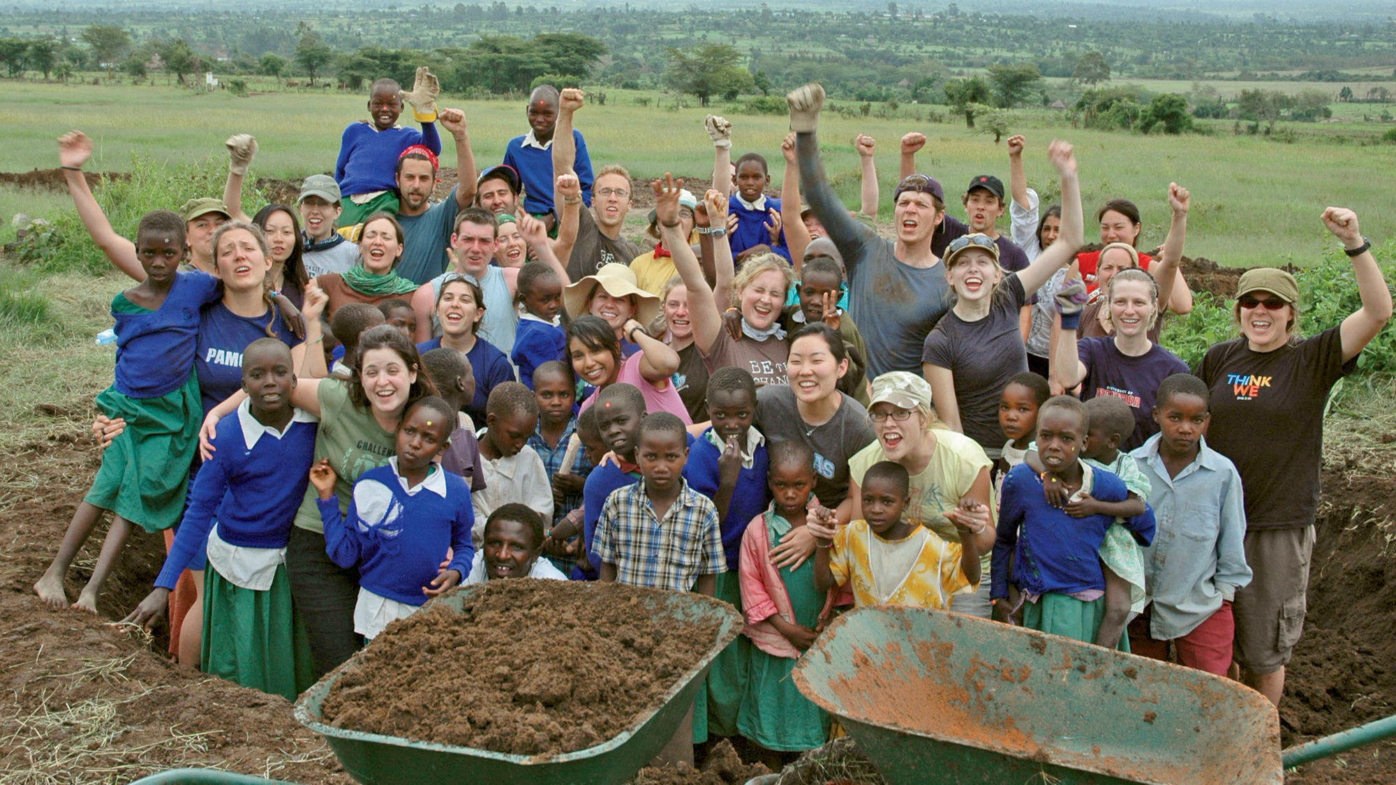 Me to We travelers help build a school in Kenya.