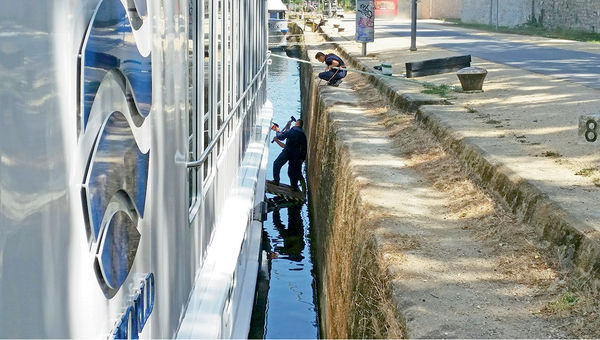 Uniworld crew members prepare vessels before the river cruising season gets underway. Uniworld crew members prepare vessels before the river cruising season gets underway.