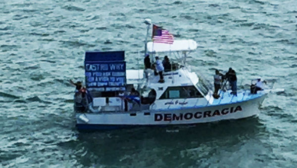 Anti-Castro government protesters took to the water ahead of Fathom's departure.
