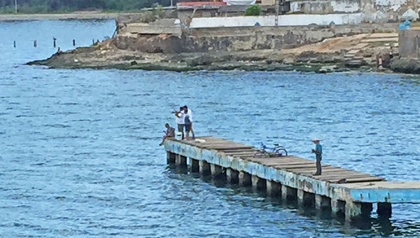 Fishermen cast out in Cojimar, where Ernest Hemingway used to launch for deep-sea excursions. Fishermen cast out in Cojimar, where Ernest Hemingway used to launch for deep-sea excursions.