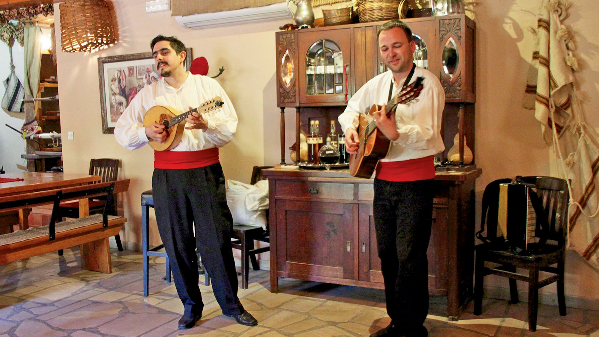 Costumed singers entertain Viking Sea passengers on an excursion in Cilipi, Croatia.