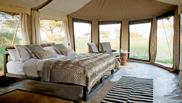 The bedroom interior of a tent at the Namiri Plains camp, in the eastern part of the Serengeti National Park. The bedroom interior of a tent at the Namiri Plains camp, in the eastern part of the Serengeti National Park.