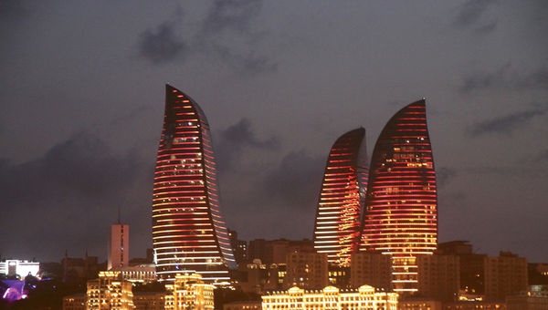 Baku’s Flame Towers, seen at night from the city’s seaside promenade. The Fairmont hotel is in the tower on the right.