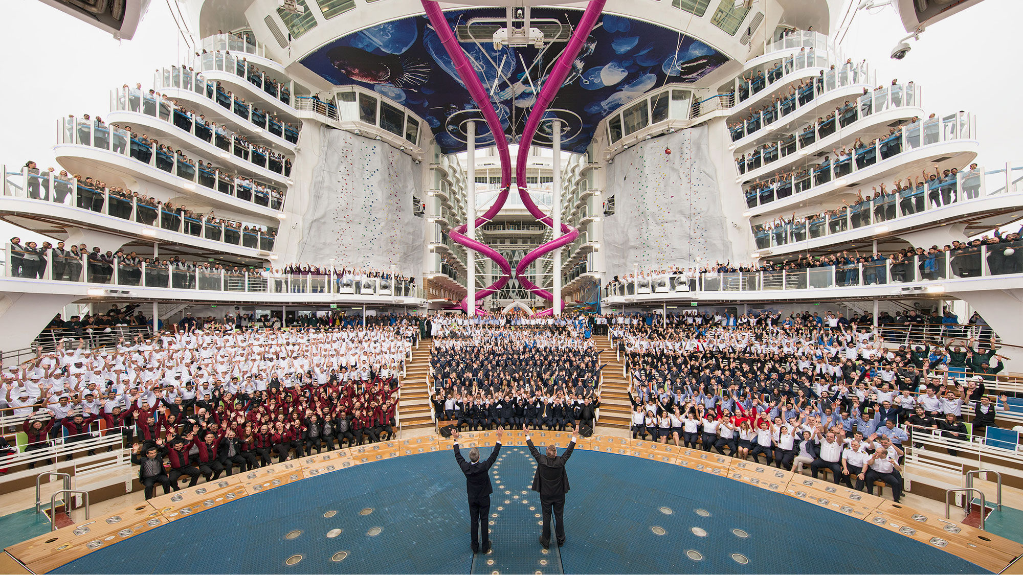 Royal Caribbean president Michael Bayley and chairman Richard Fain celebrate the arrival of Harmony of the Seas with crew and project team.