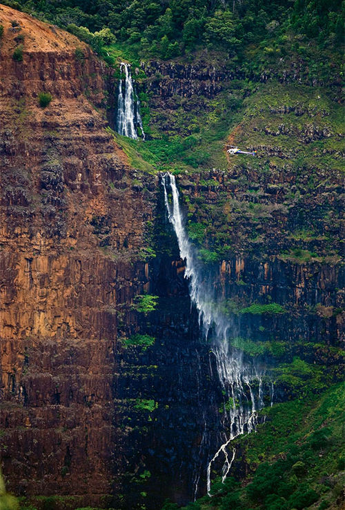 Waimea Canyon Waterfall on Kauai, a popular island for honeymooners and families. Waimea Canyon Waterfall on Kauai, a popular island for honeymooners and families.