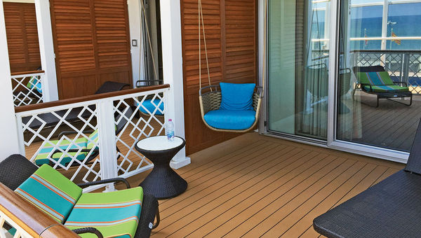 The patio of a Havana Cabana suite includes a swing chair.