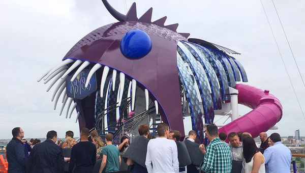 Passengers line up for their turn on the Abyss slide. The entrance is through the mouth of an anglerfish sculpture. Passengers line up for their turn on the Abyss slide. The entrance is through the mouth of an anglerfish sculpture.